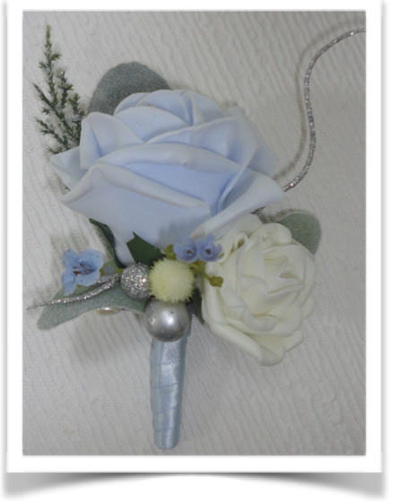 Pale blue artificial buttonhole